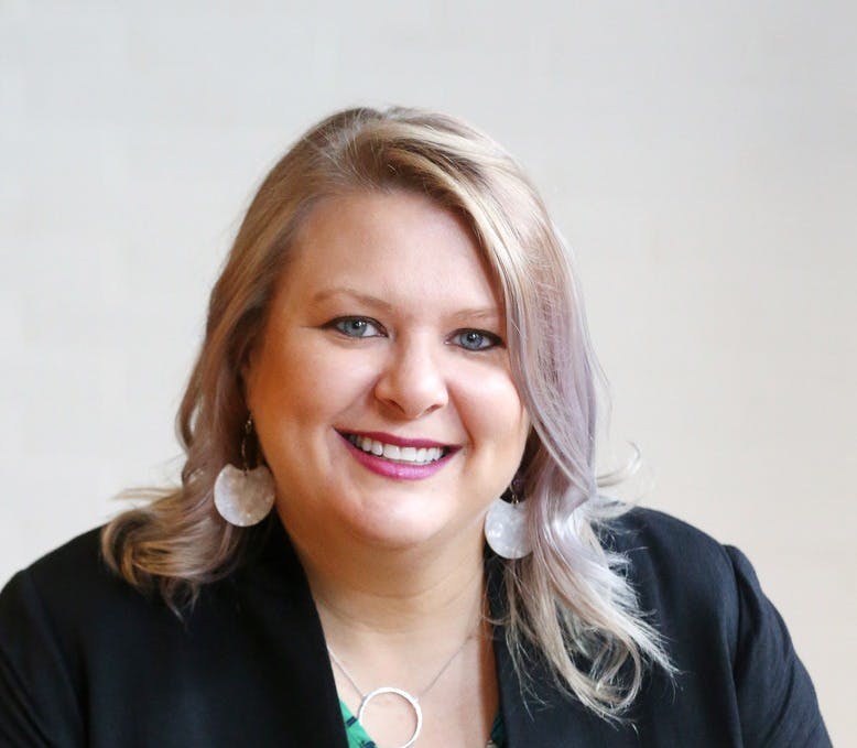 a woman smiling for the camera