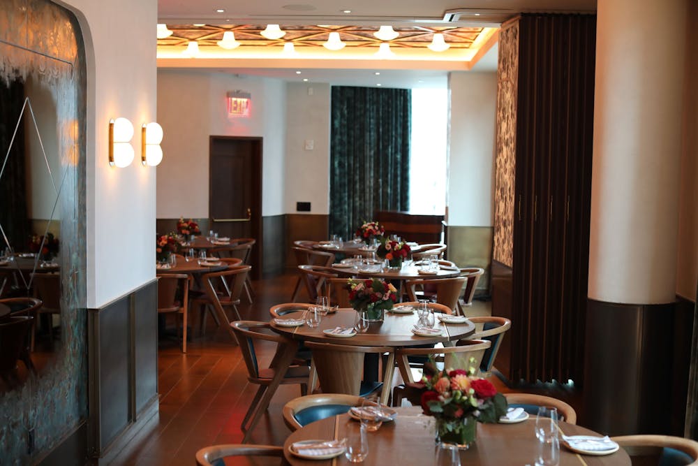 a living room filled with furniture and a large window