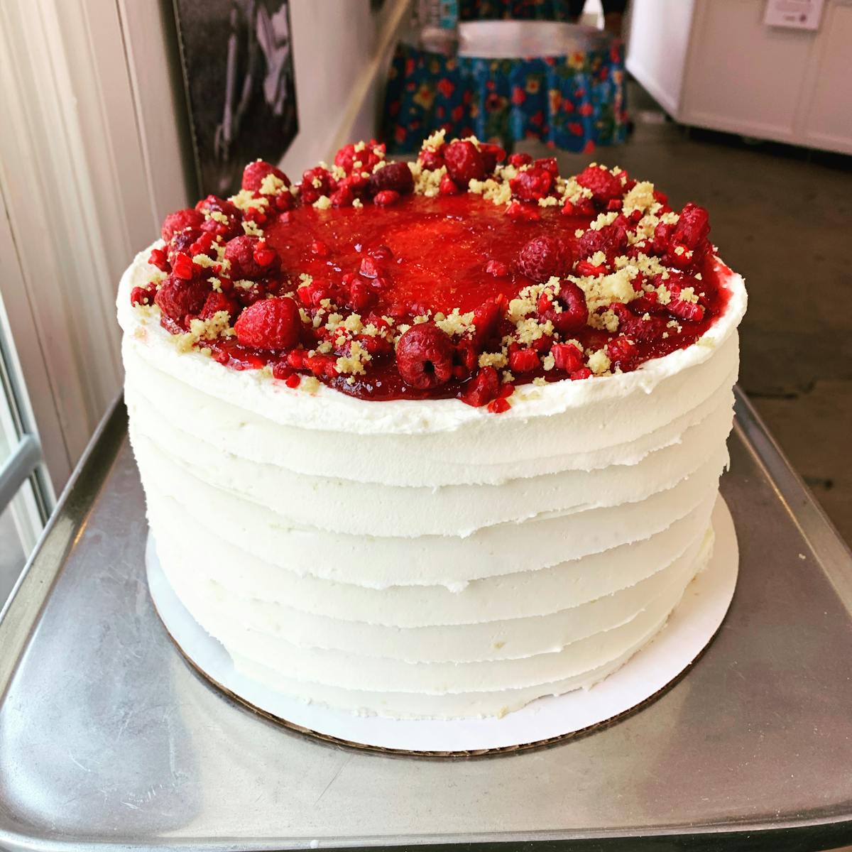 a plate of food that is on a cutting board with a cake