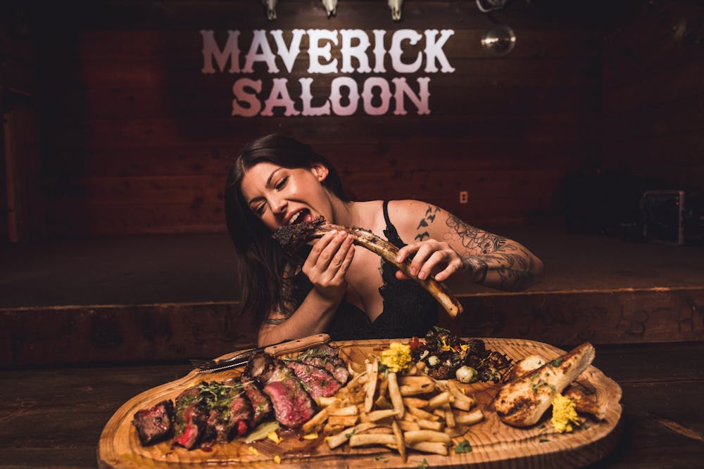 a person eating a slice of pizza