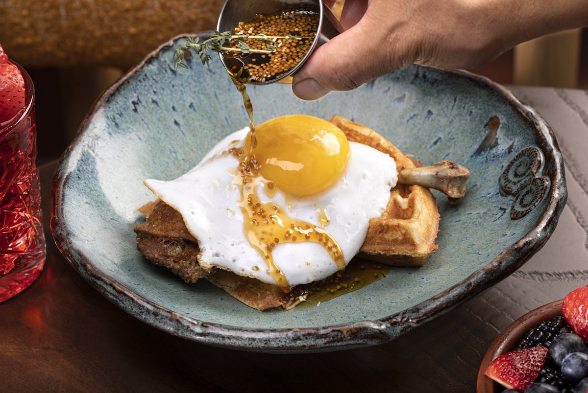 duck & waffle, crispy leg confit, fried duck egg, mustard maple syrup