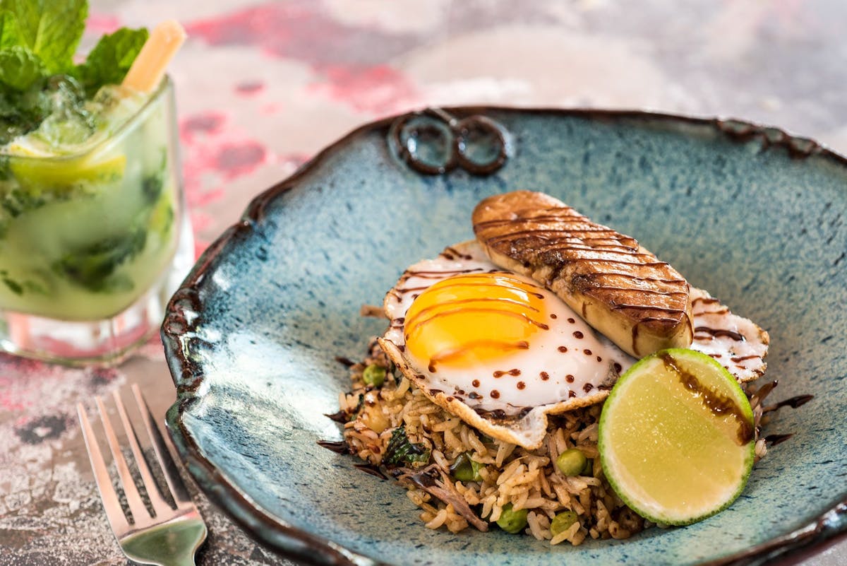 Duck fried rice with egg and lime