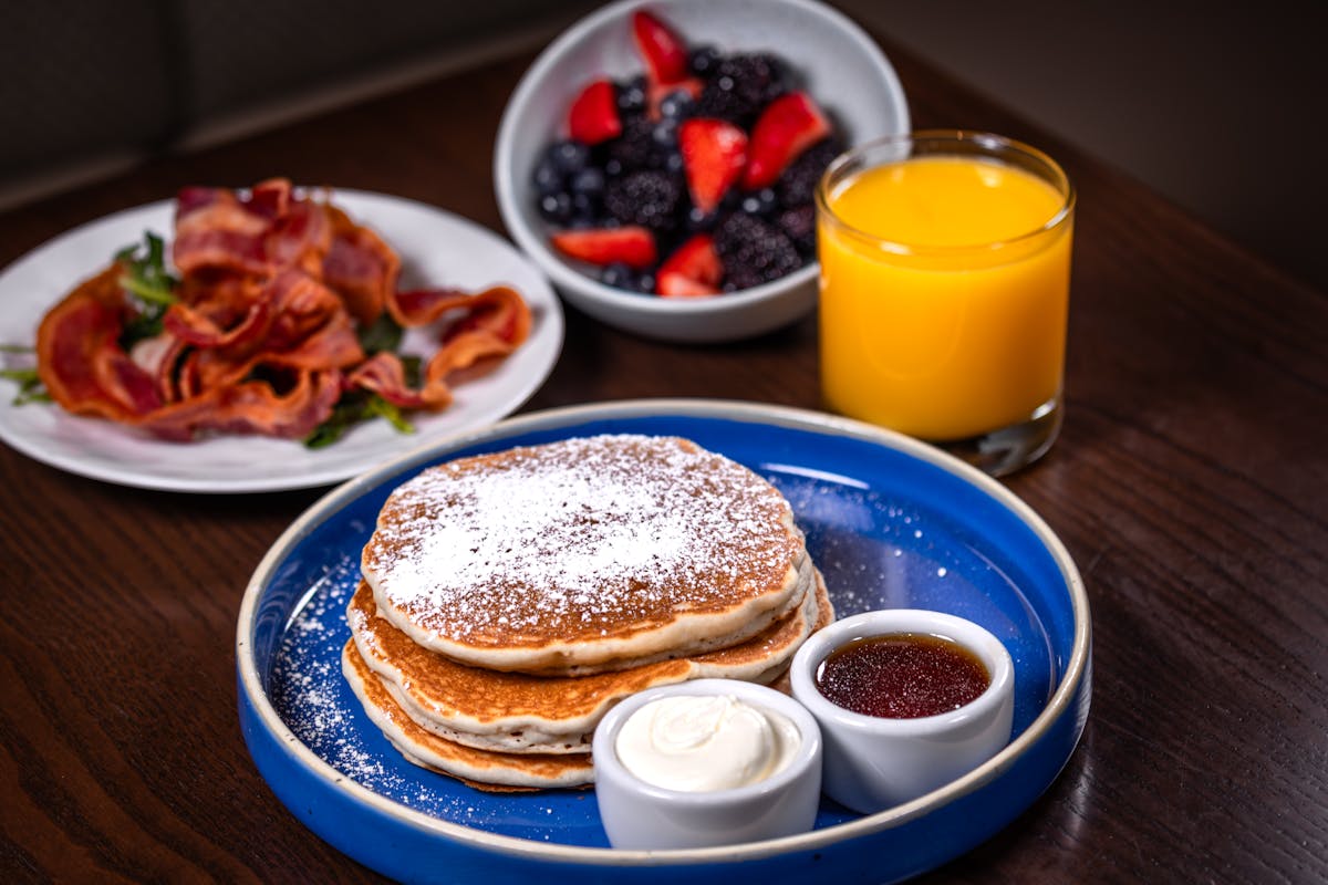 Pancakes and bacon with an orange juice from Sugarcane, which is a restaurant based in The Venetian Hotel in Las Vegas.