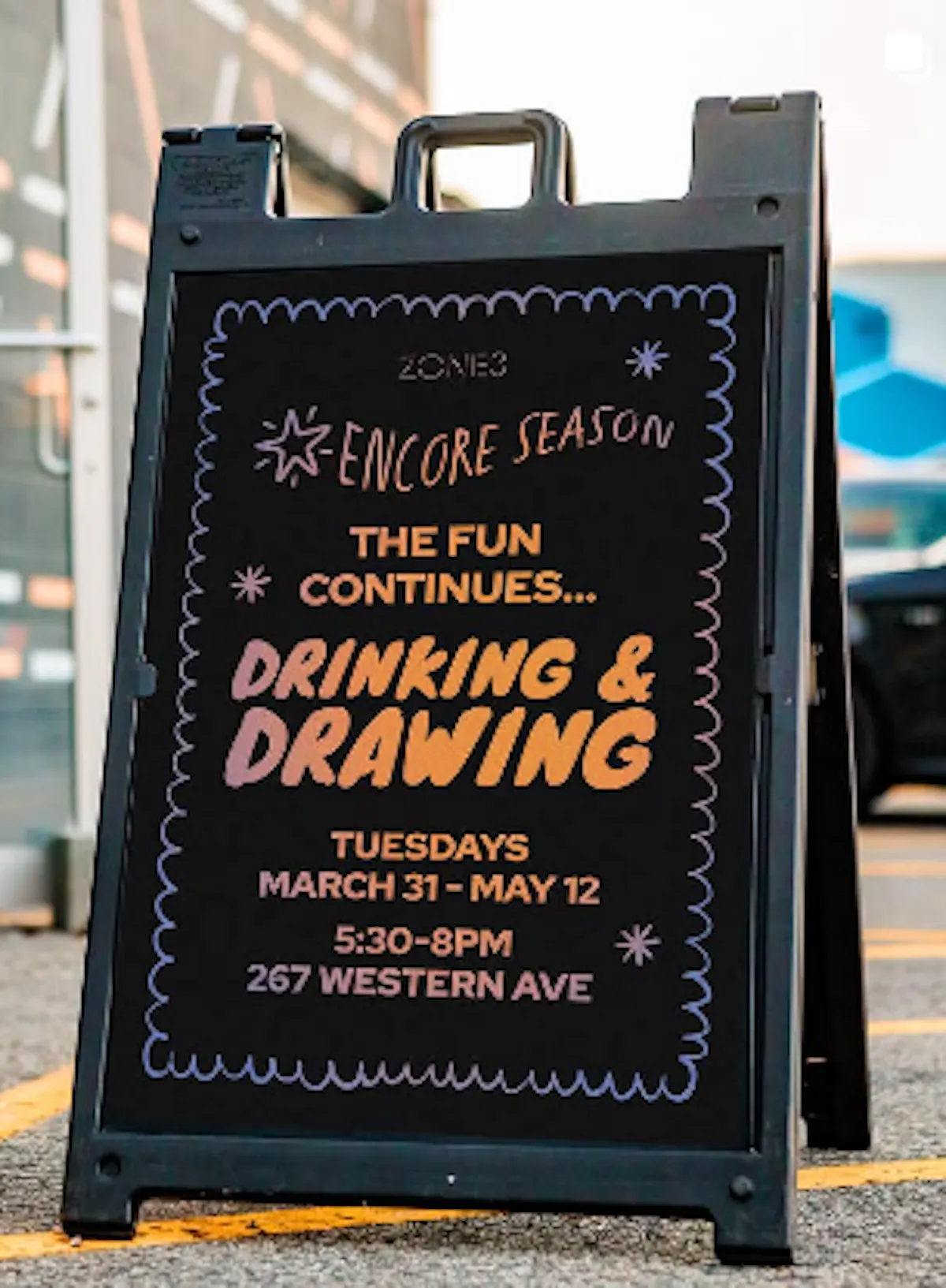 a black sign with writing on it