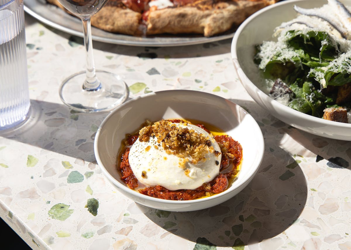 a bowl of food on a plate on a table