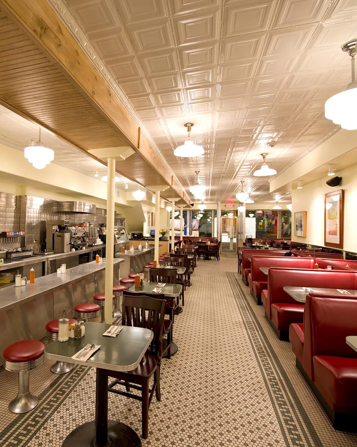 a room filled with furniture and a table in a restaurant