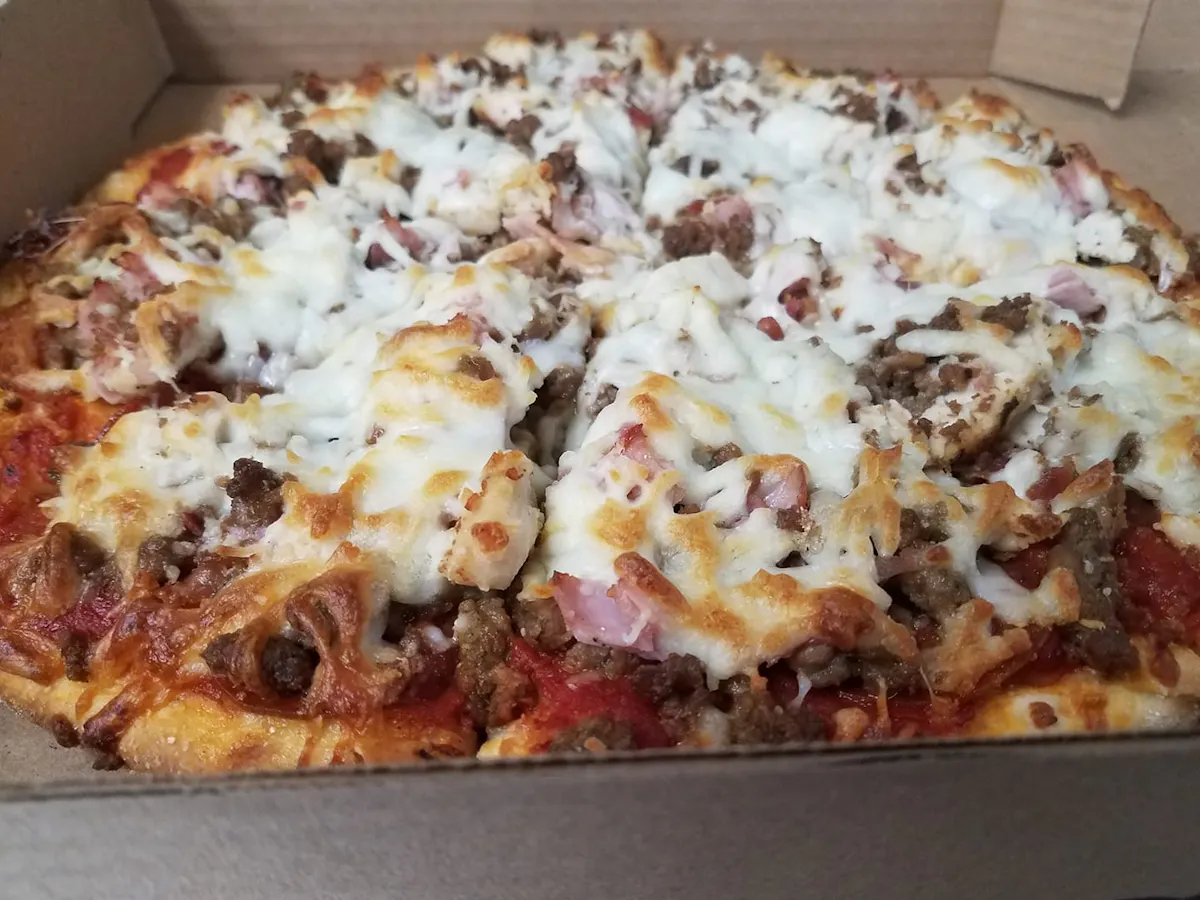 a slice of pizza in a box