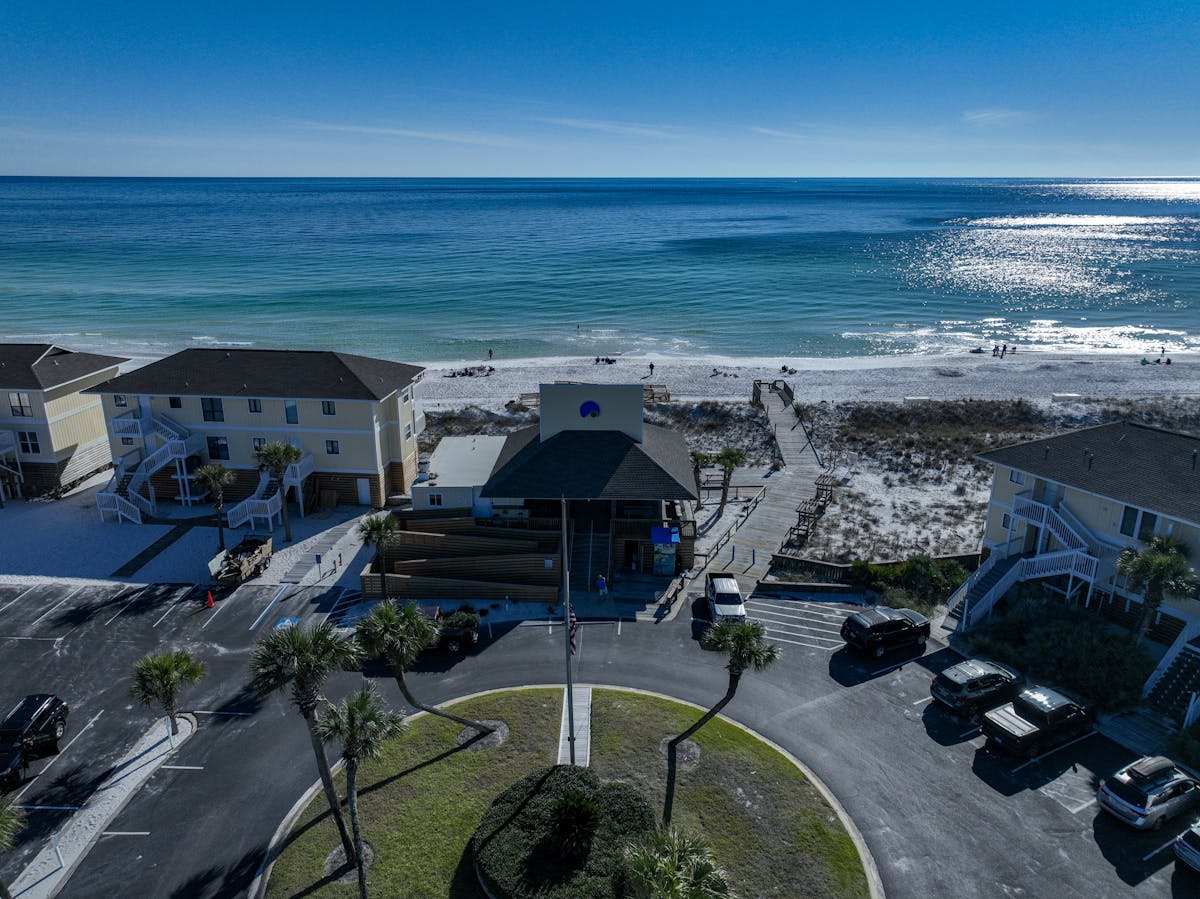 a group of lawn chairs sitting on top of a beach