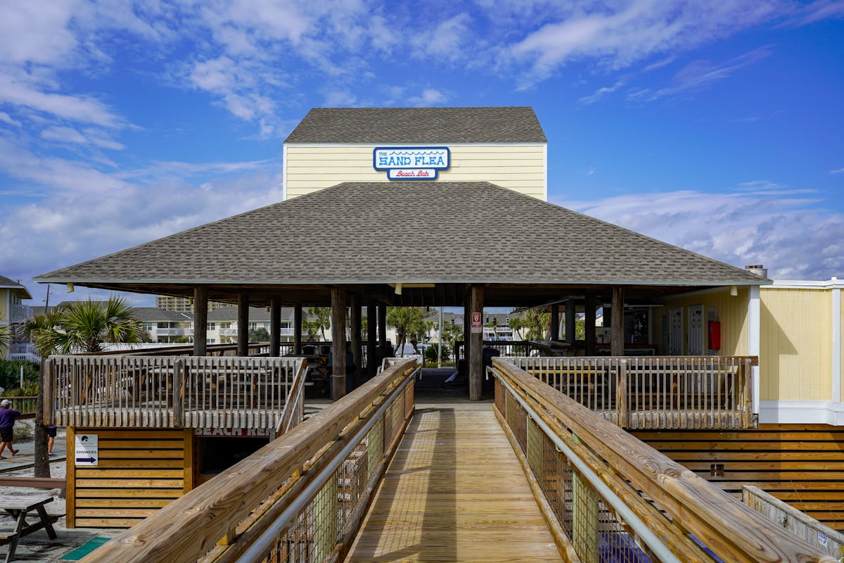a wooden dock in front of Rock and Roll Hall of Fame