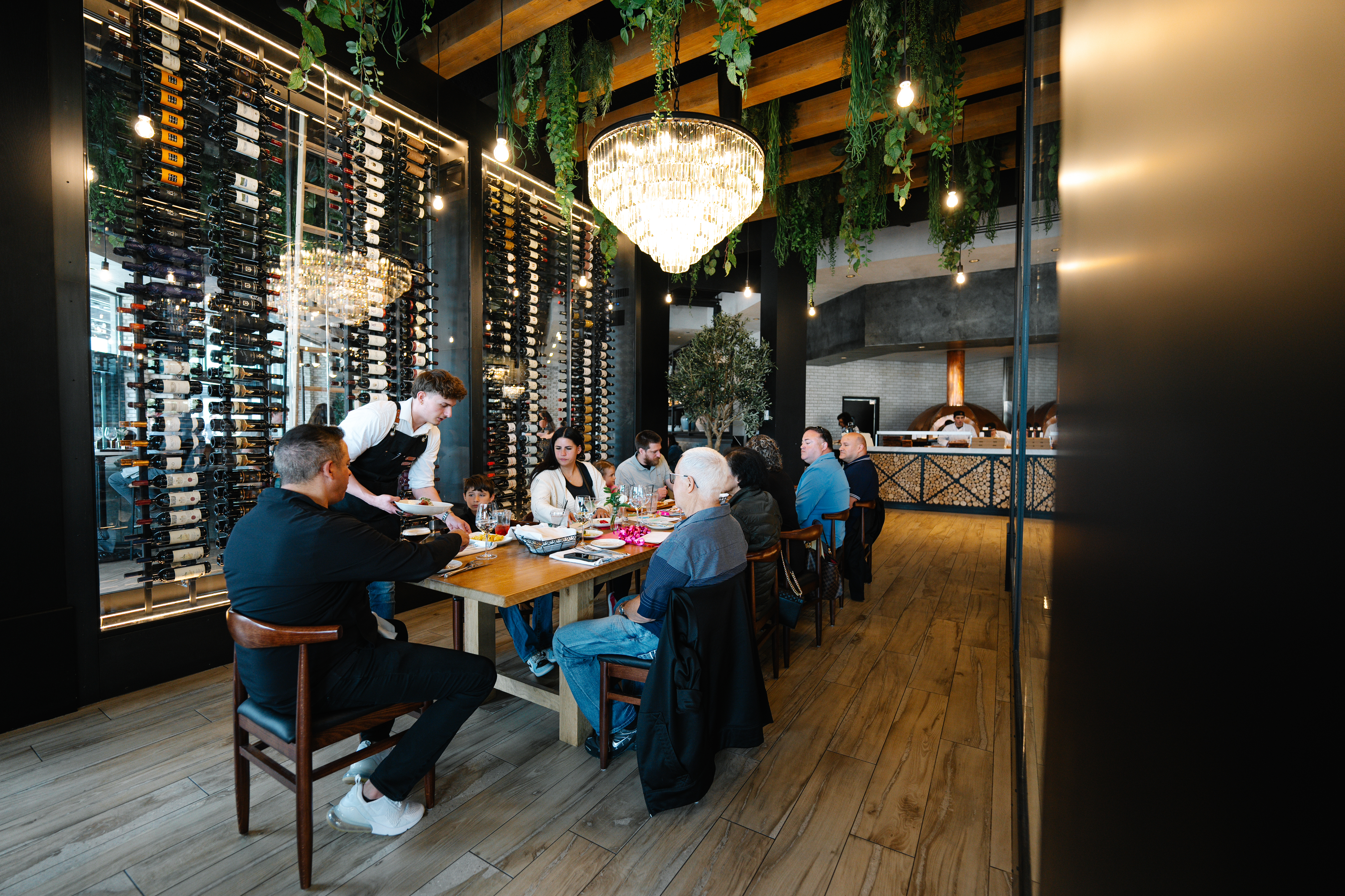 a group of people sitting at a table in a restaurant