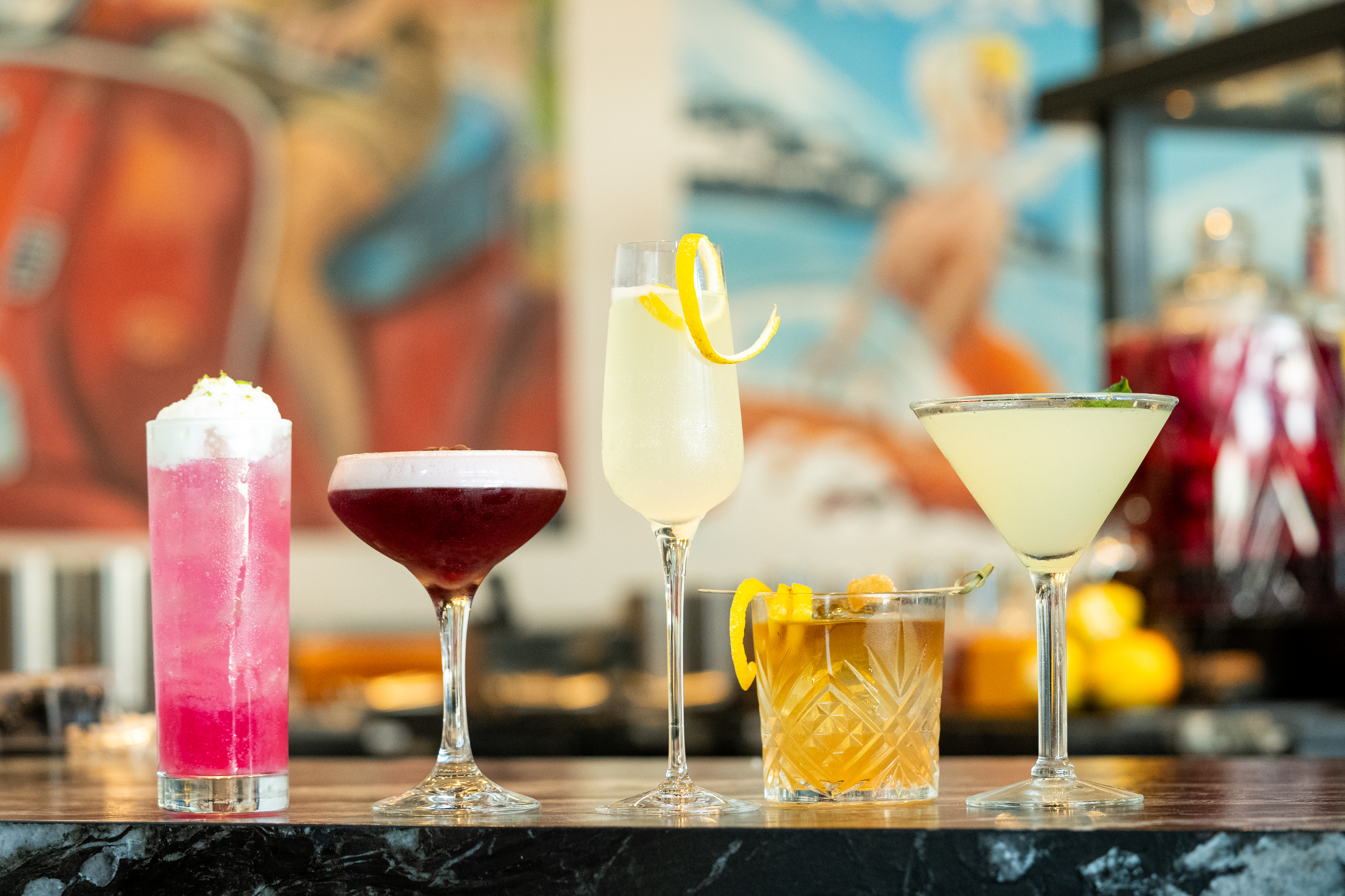 a group of different colored drinks