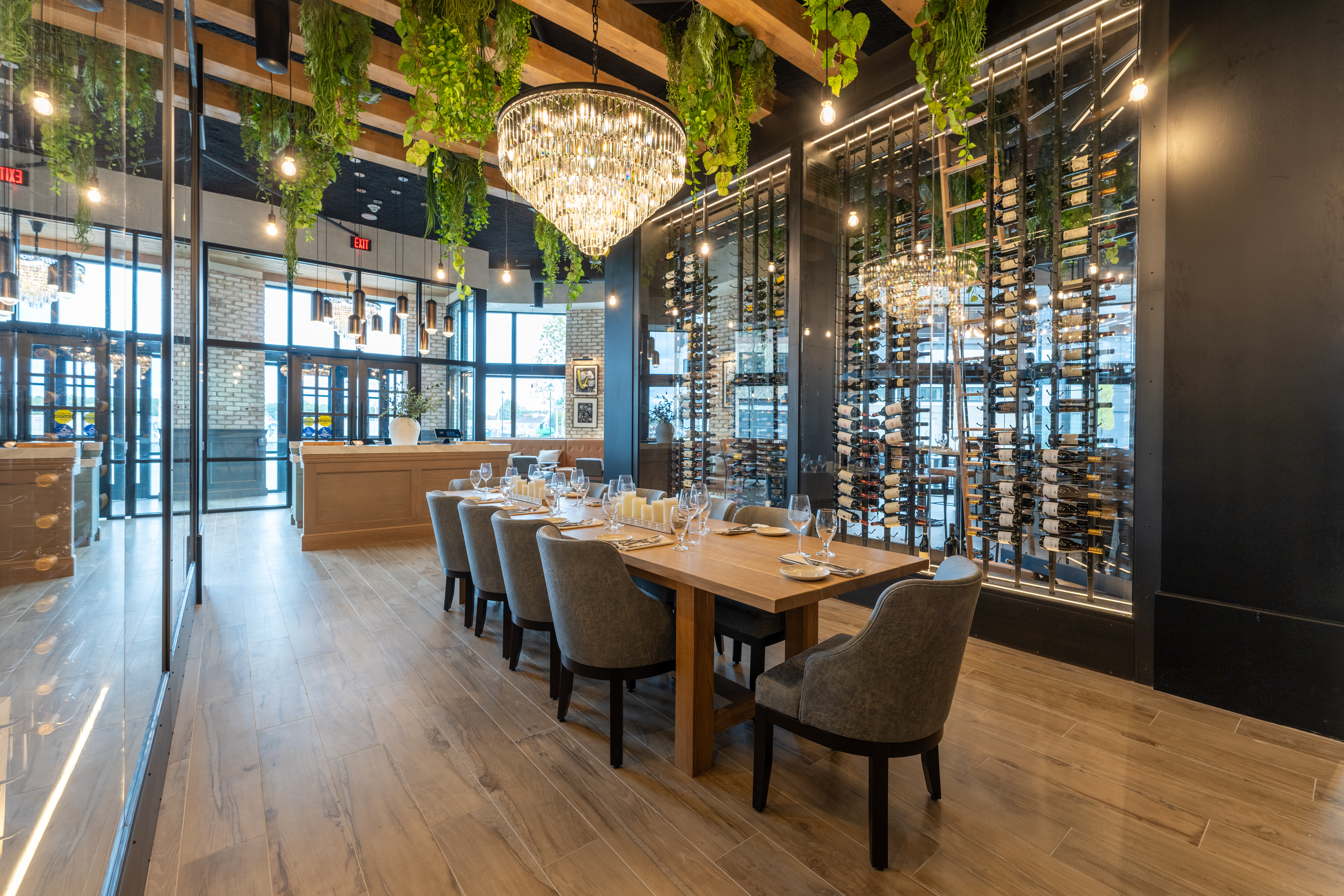 a restaurant with a wine rack and wine bottles