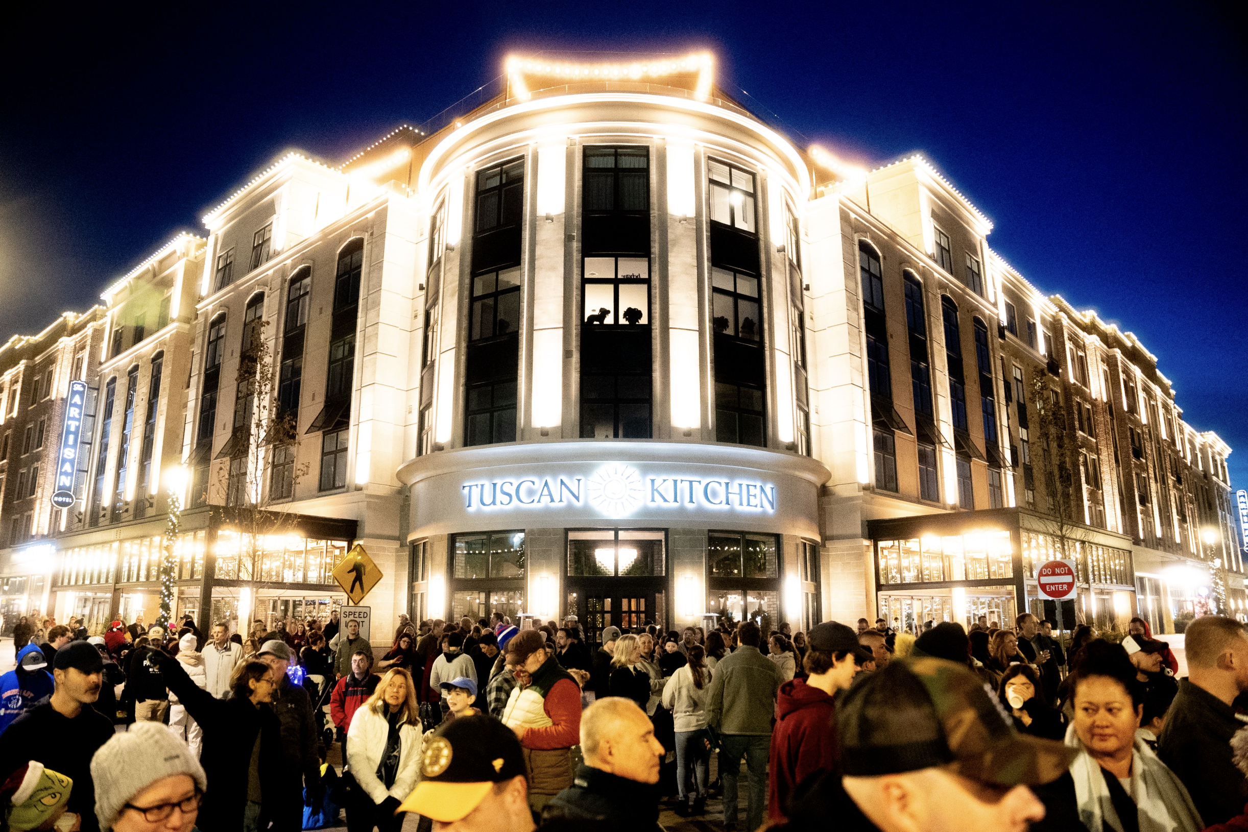 a large crowd of people outside of a building