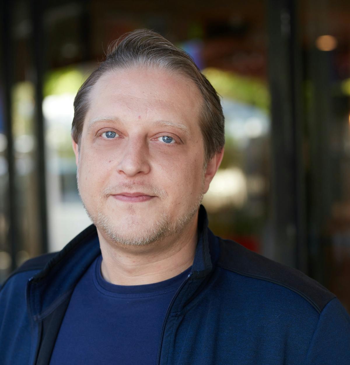 a man wearing a blue shirt