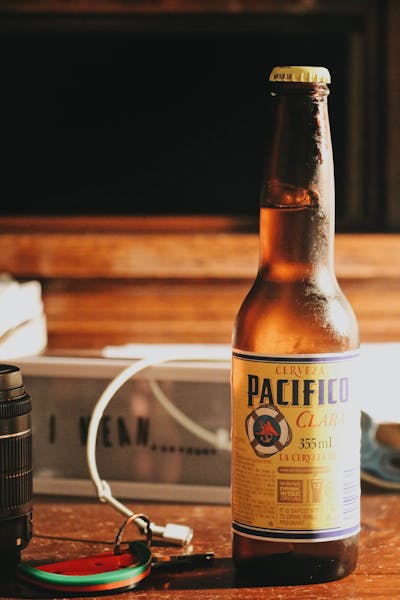 a bottle of wine sitting on top of a wooden table
