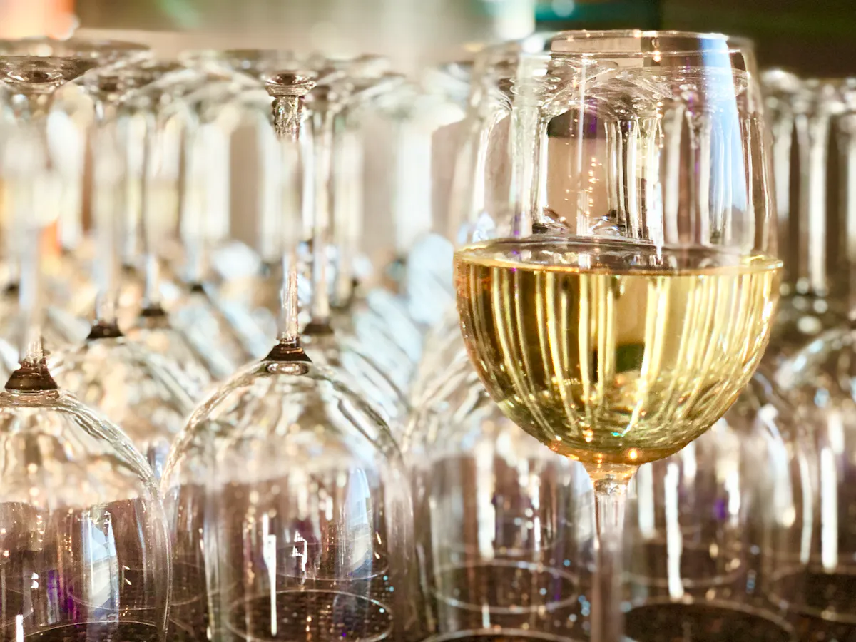 a glass filled with wine glasses