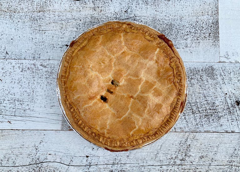Apple pie on wood background