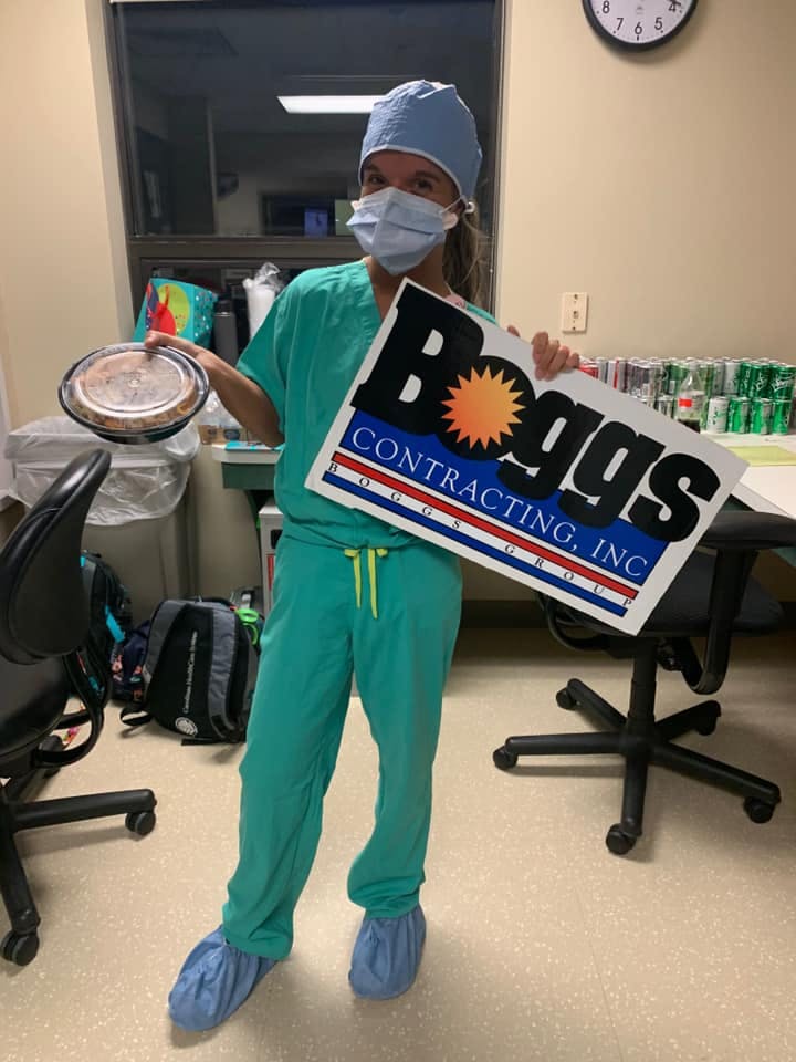 a person standing in front of a computer