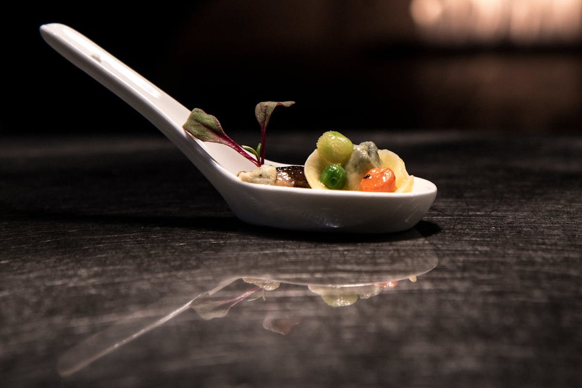 a close up of a bowl of fruit sitting on a table