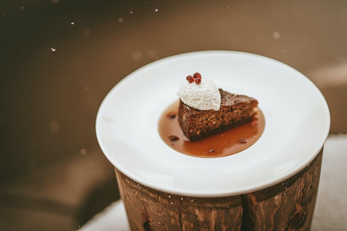 a cup of coffee and a donut on a plate