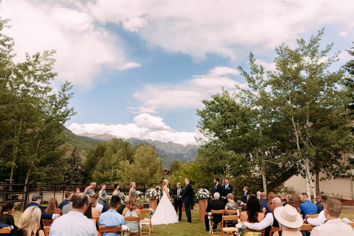 Larkspur Wedding Venue Vail Colorado Mountain Wedding a group of people in a park
