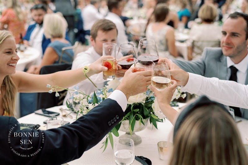 a group of people sitting at a table in front of a crowd