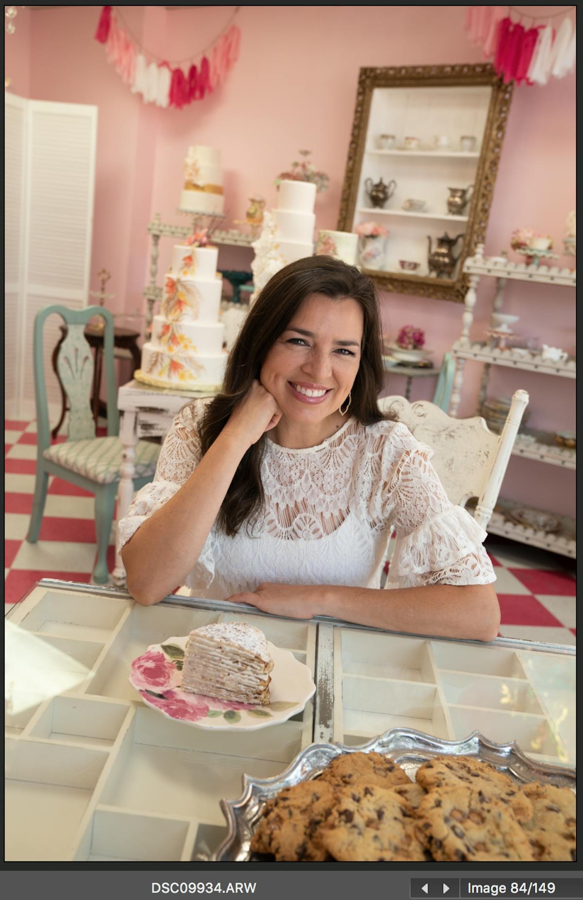 a woman sitting at a table with food