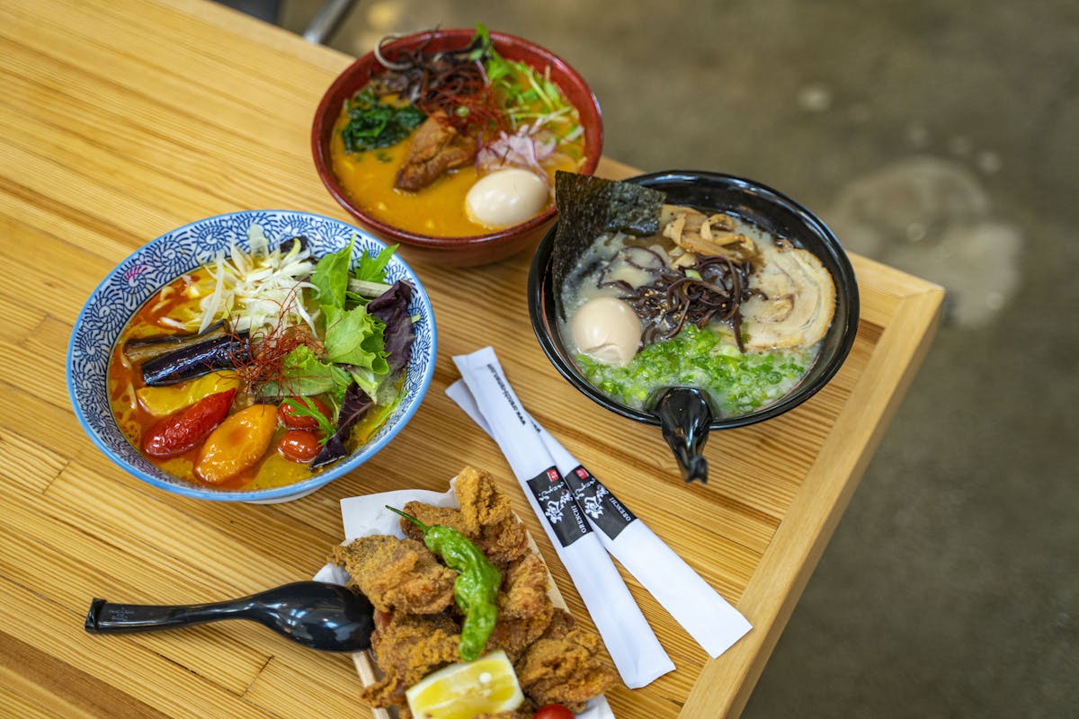 a plate of food sitting on top of a wooden table