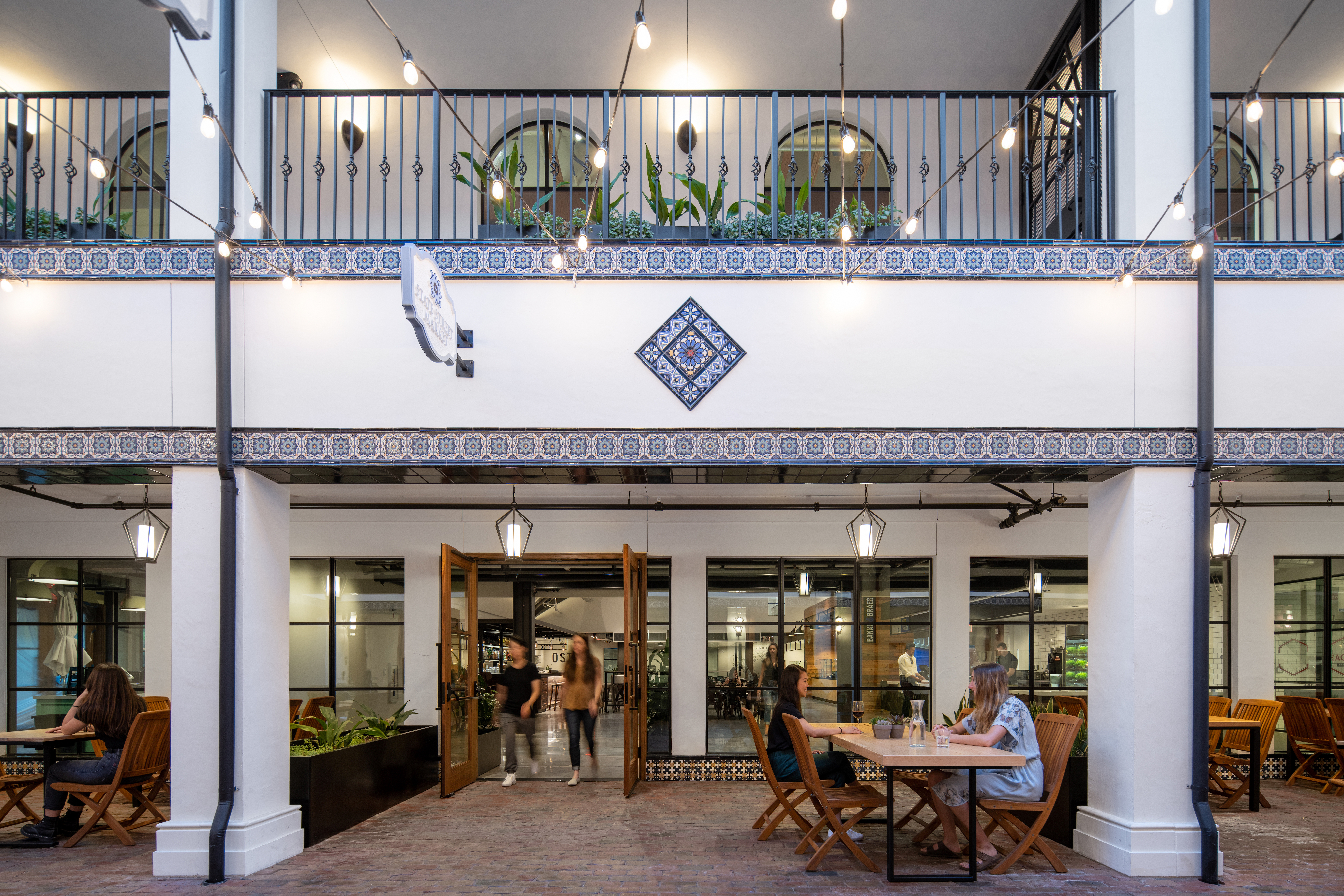 a living room filled with furniture and a large window