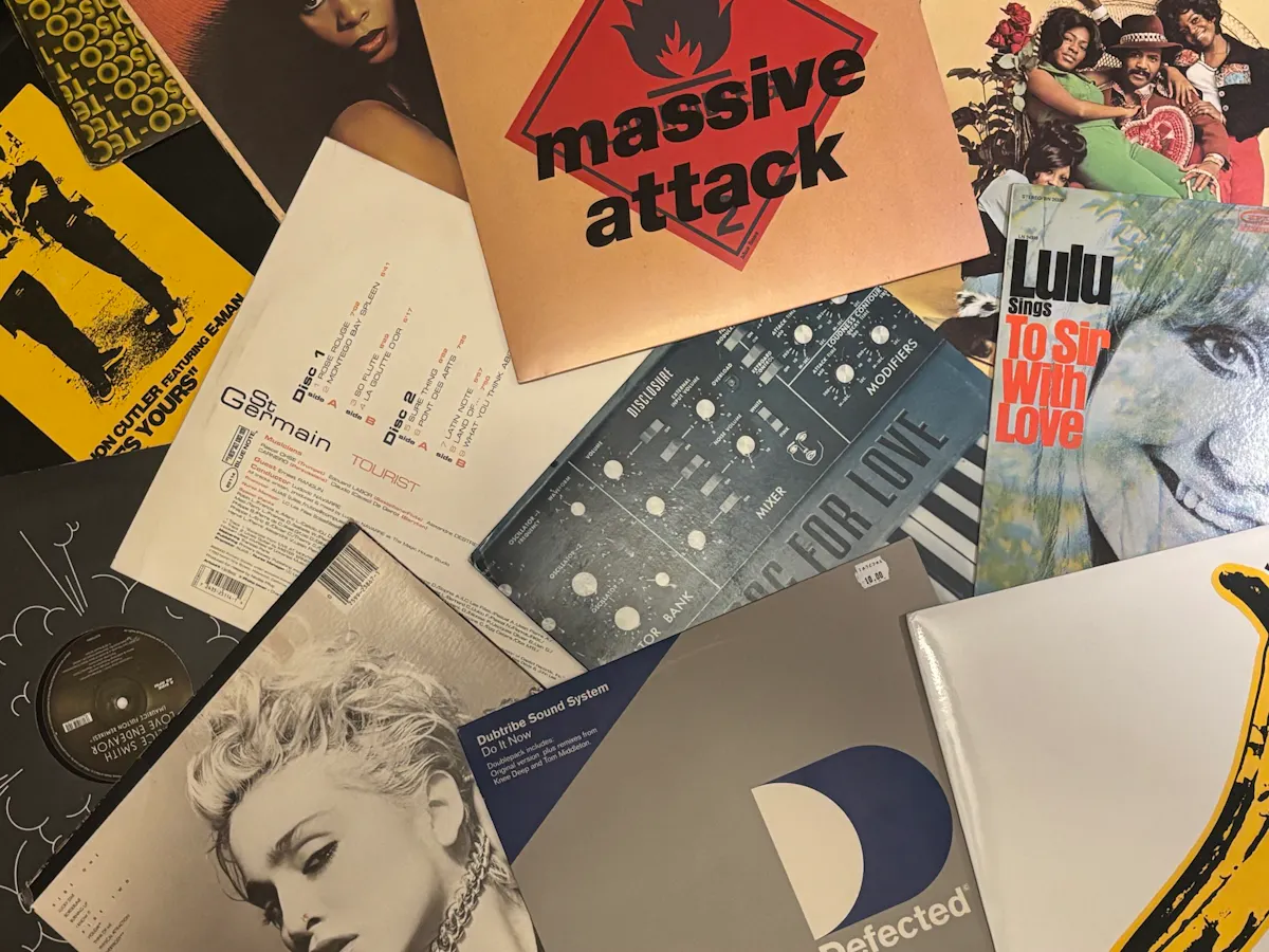 a pile of records on a table
