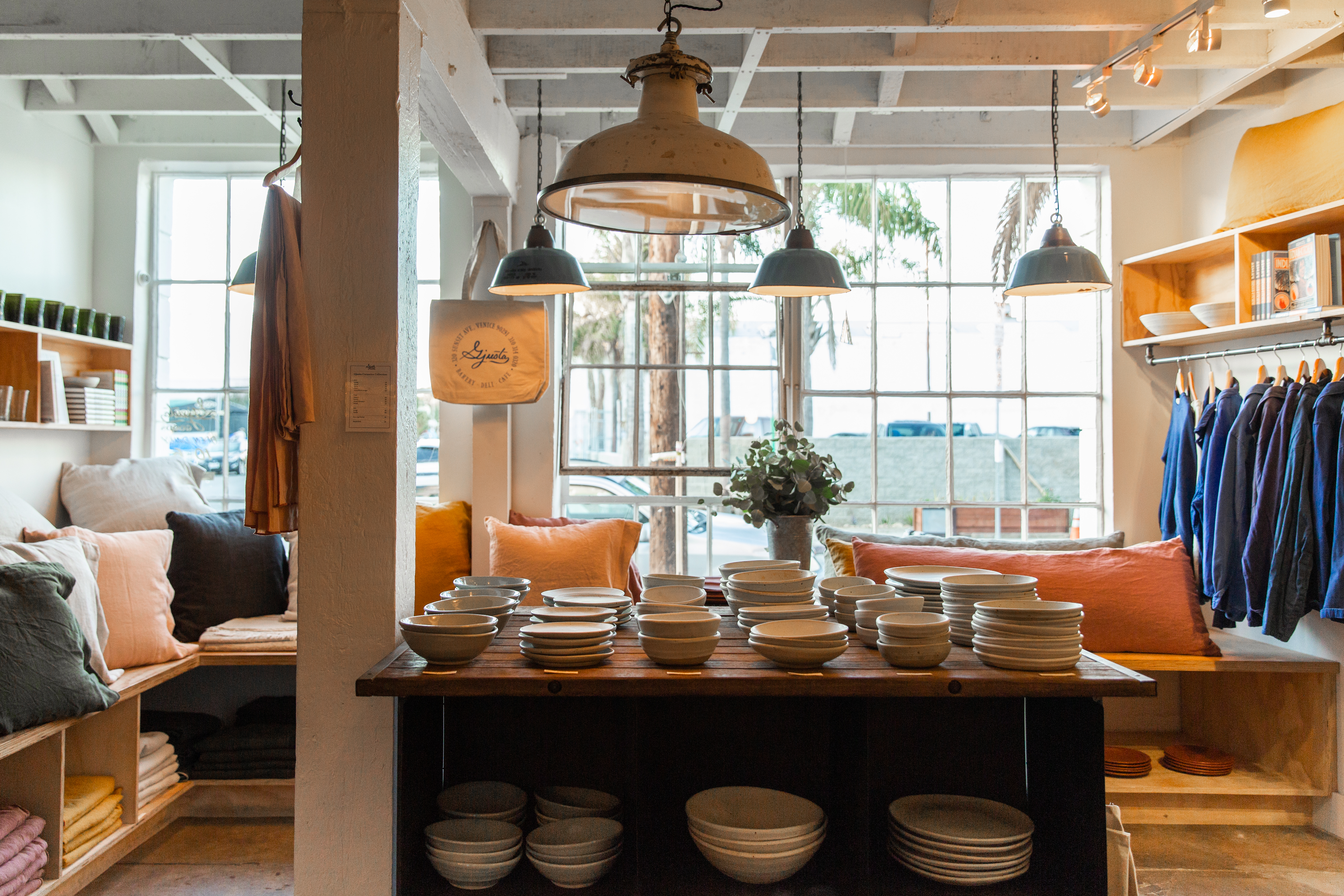 a living room filled with furniture and a large window