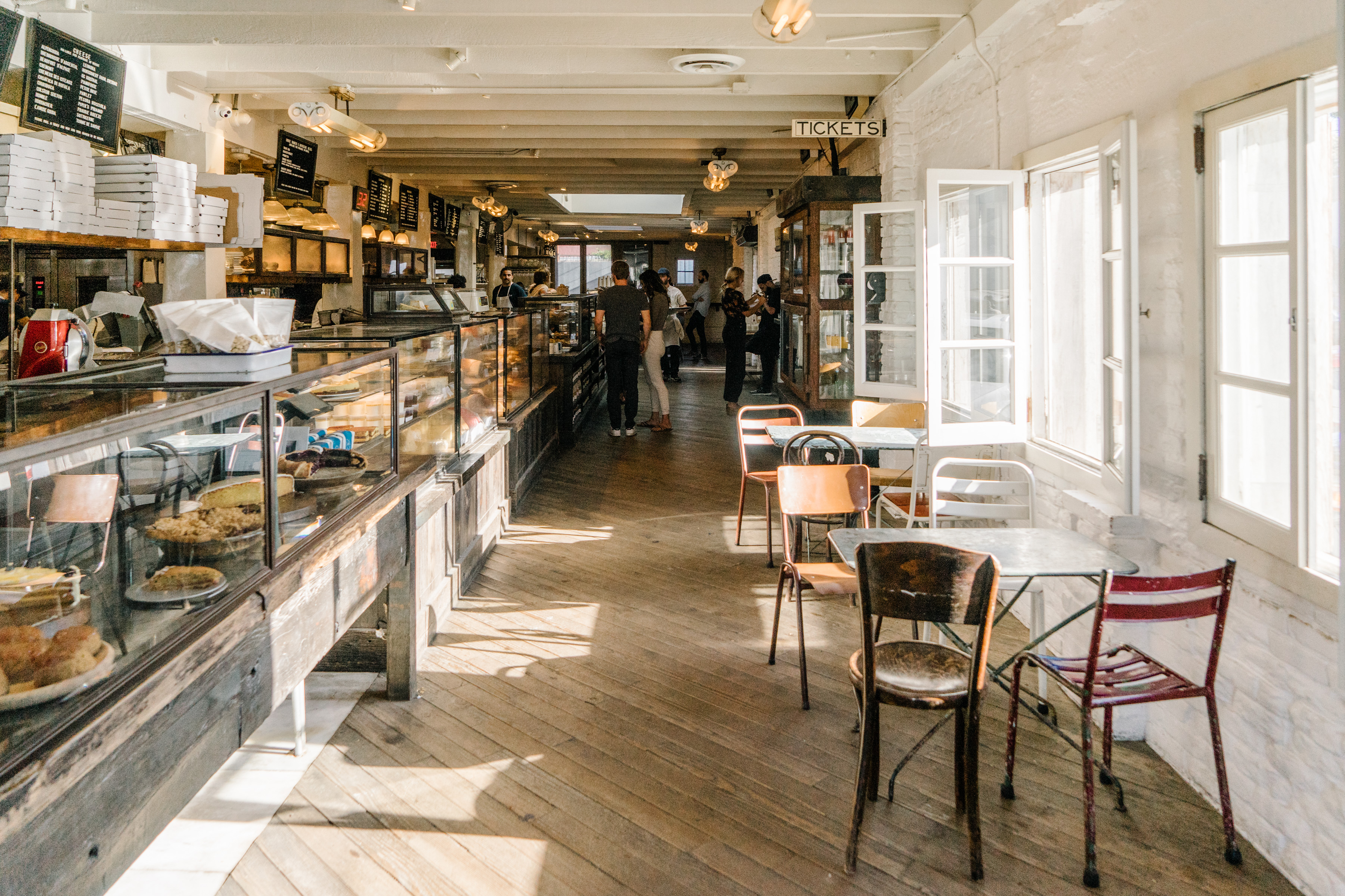 a room filled with furniture and a large window