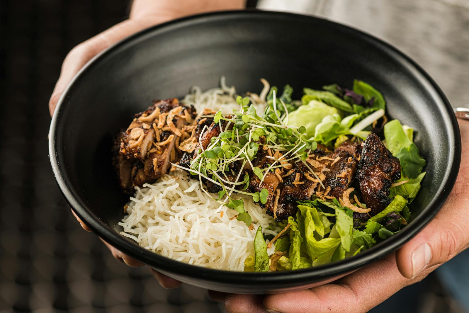 a bowl filled with meat and vegetables
