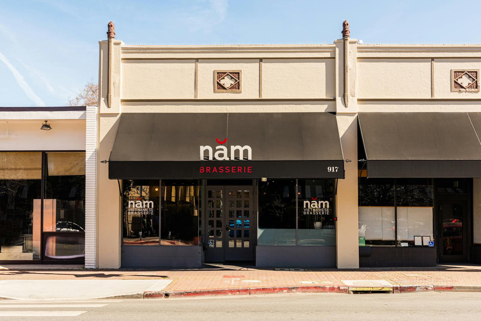 a building with a store on the corner of a street