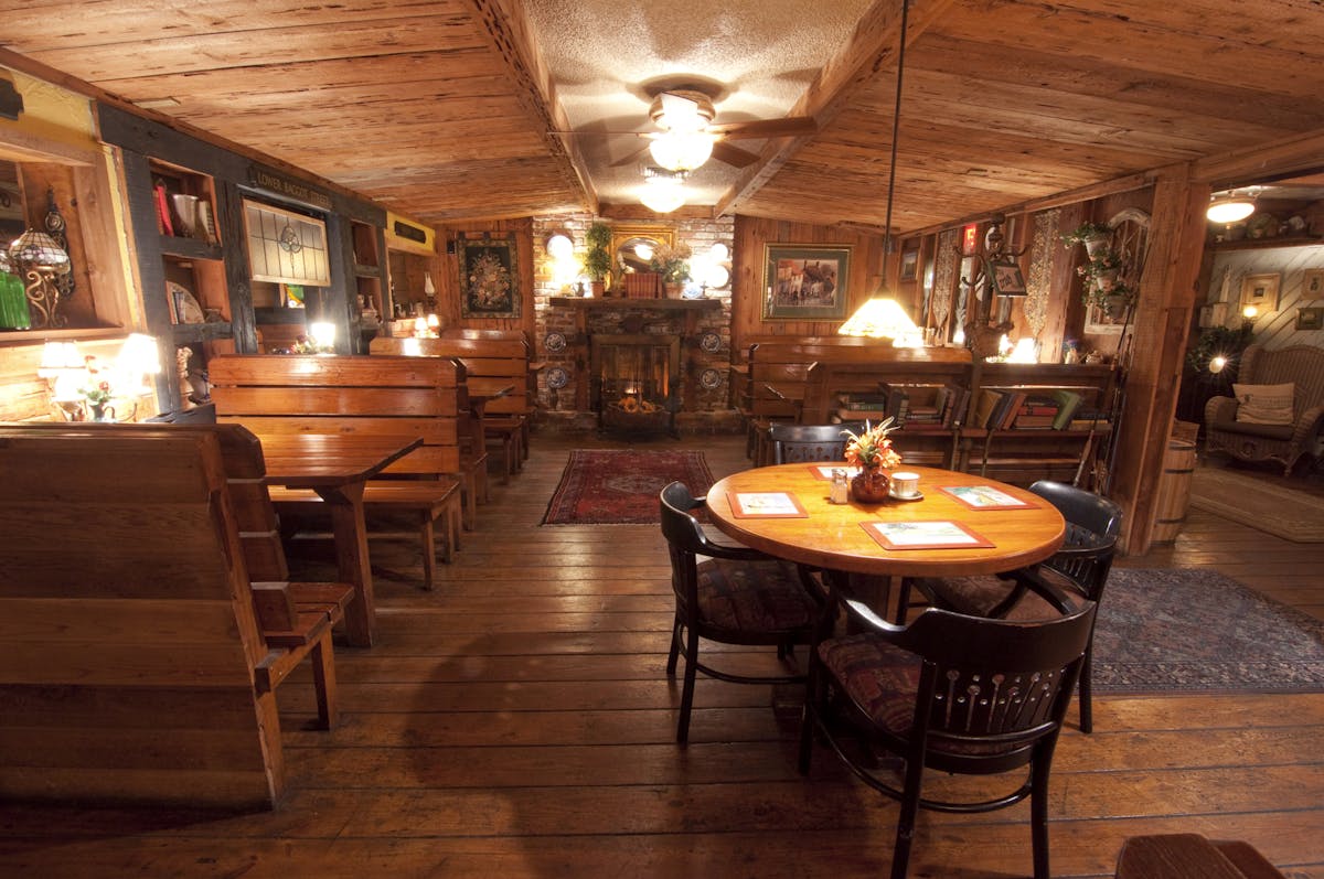 a large dining room filled with wooden furniture