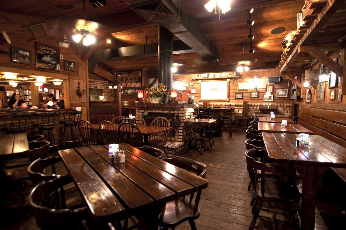 a large dining room filled with wooden furniture