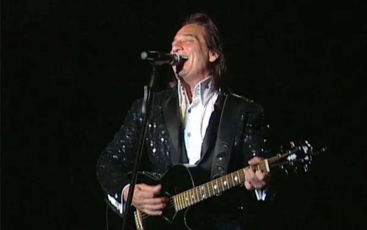 a person holding a guitar