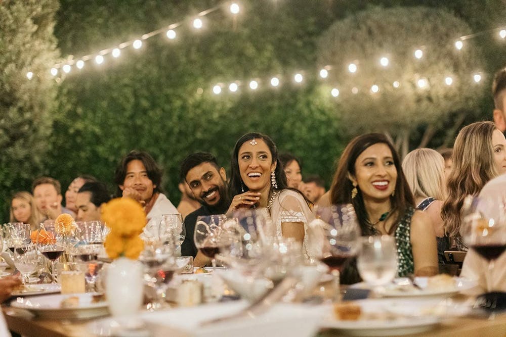 a group of people sitting at a table with wine glasses