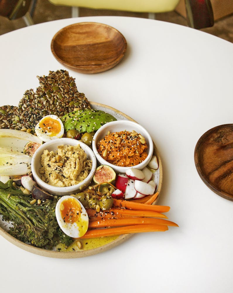 a white plate topped with different types of food on a table