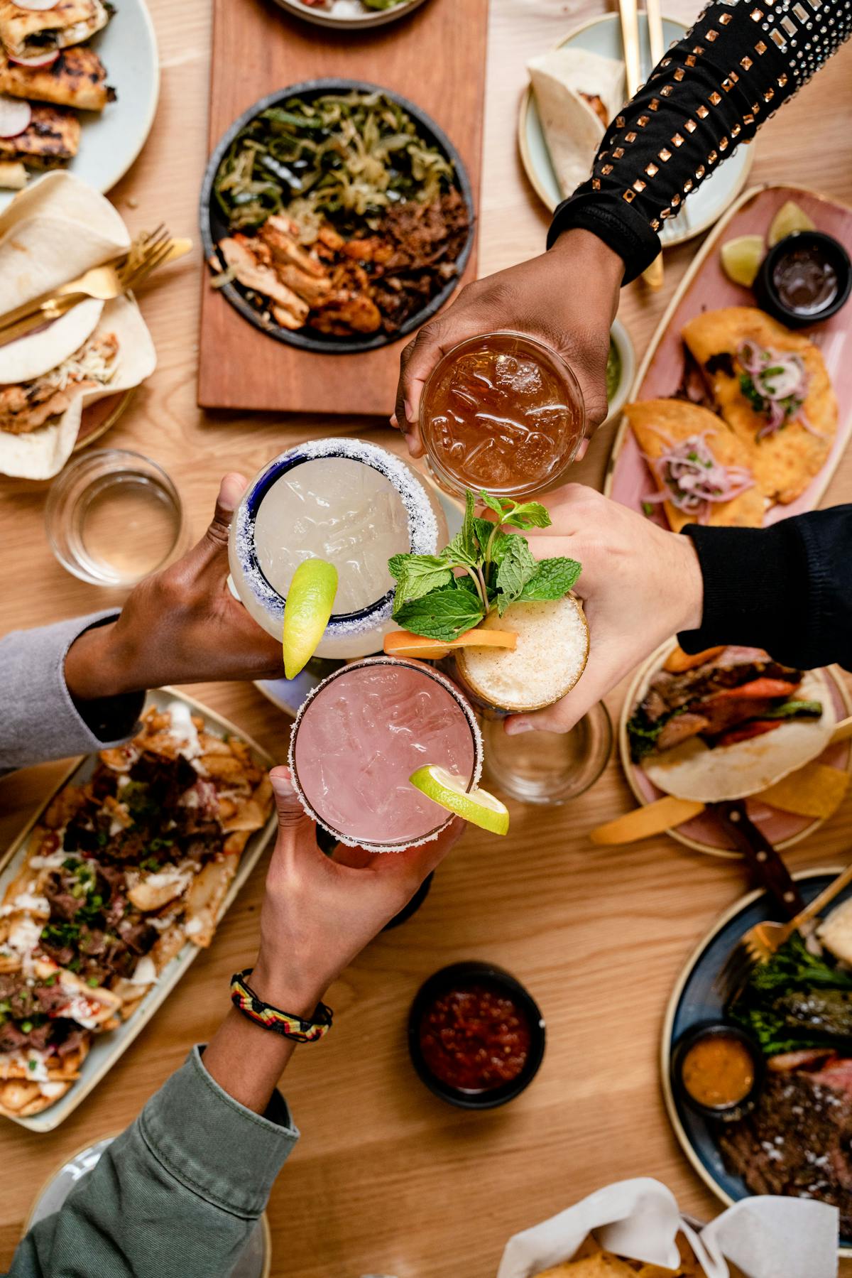 a bunch of food sitting on top of a wooden table