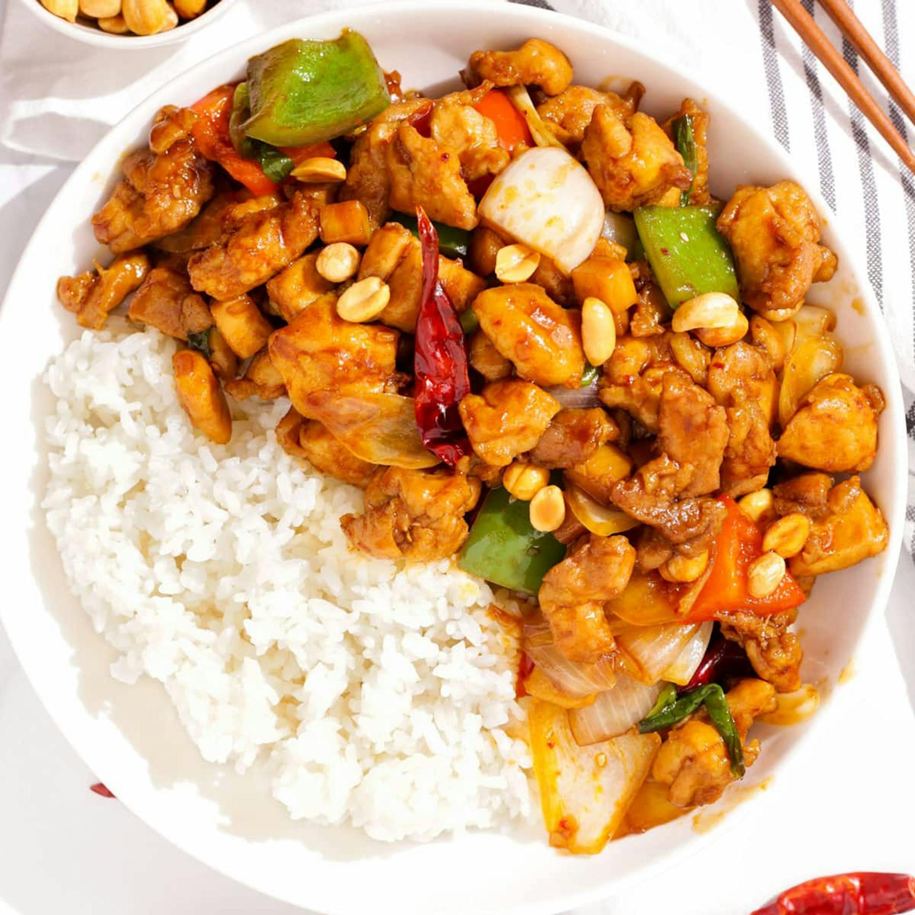 a plate of food with rice meat and vegetables
