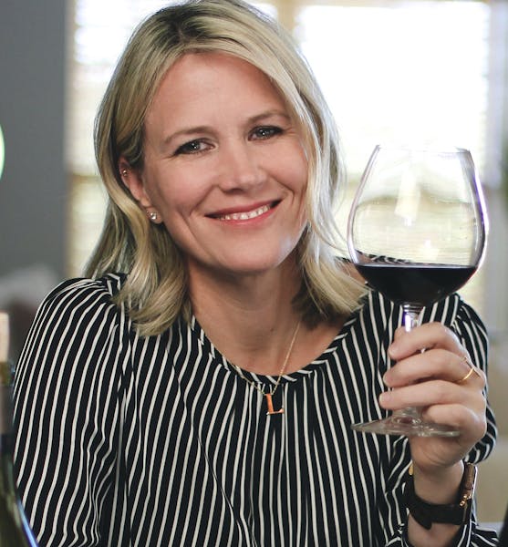 Leslee Miller holding a wine glass