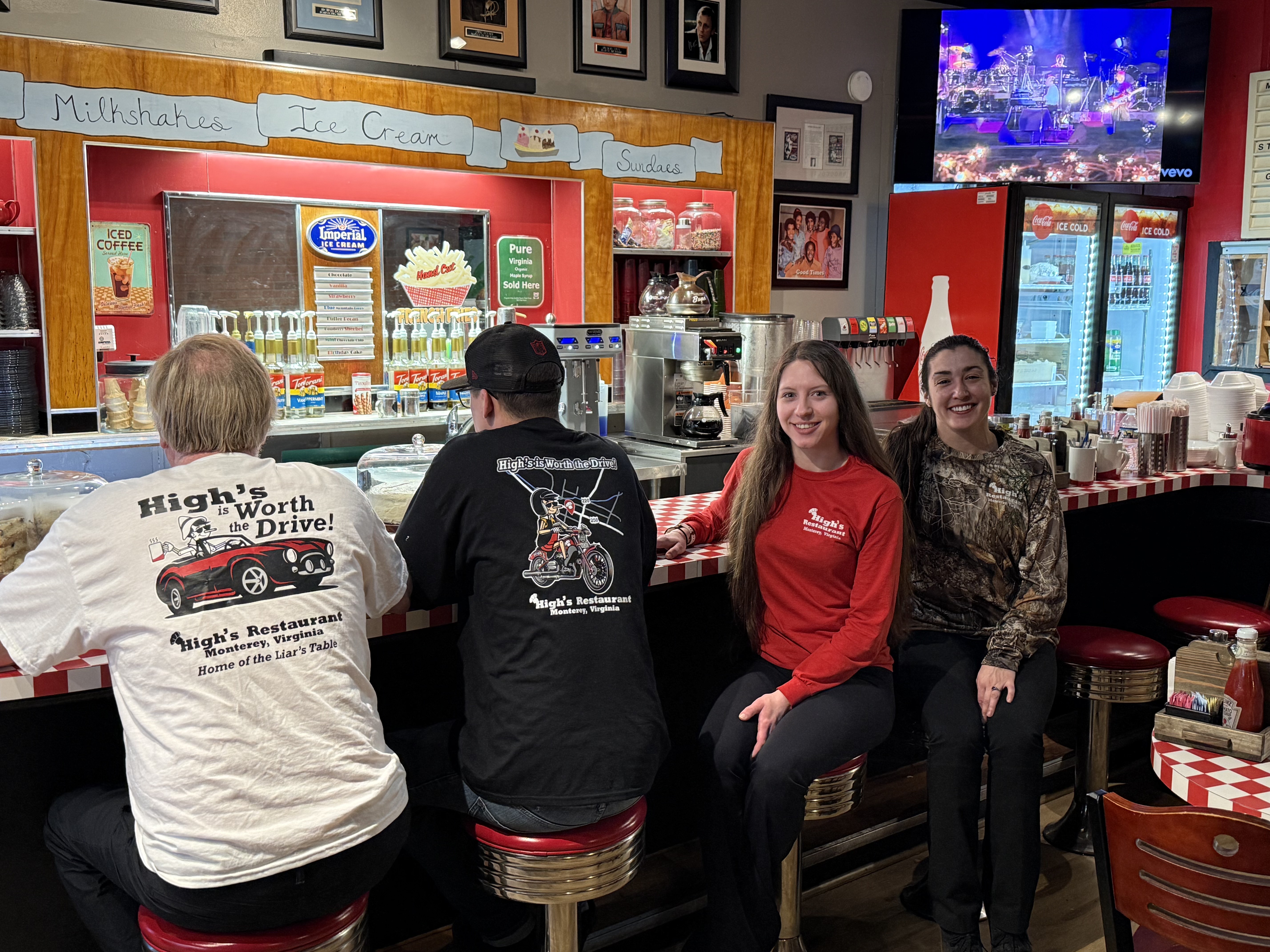 a group of people standing in front of a store