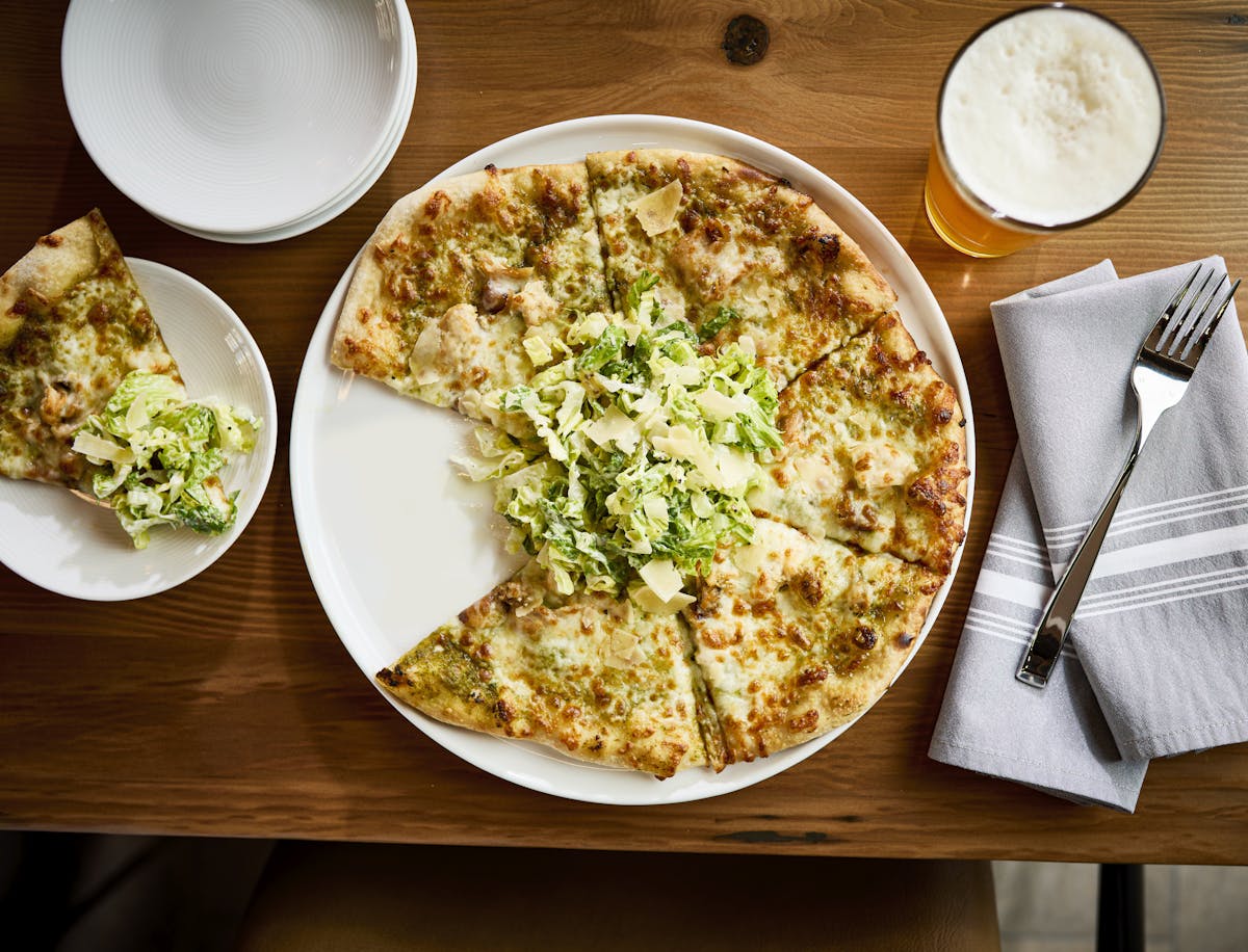 a plate of food sitting on top of a wooden table