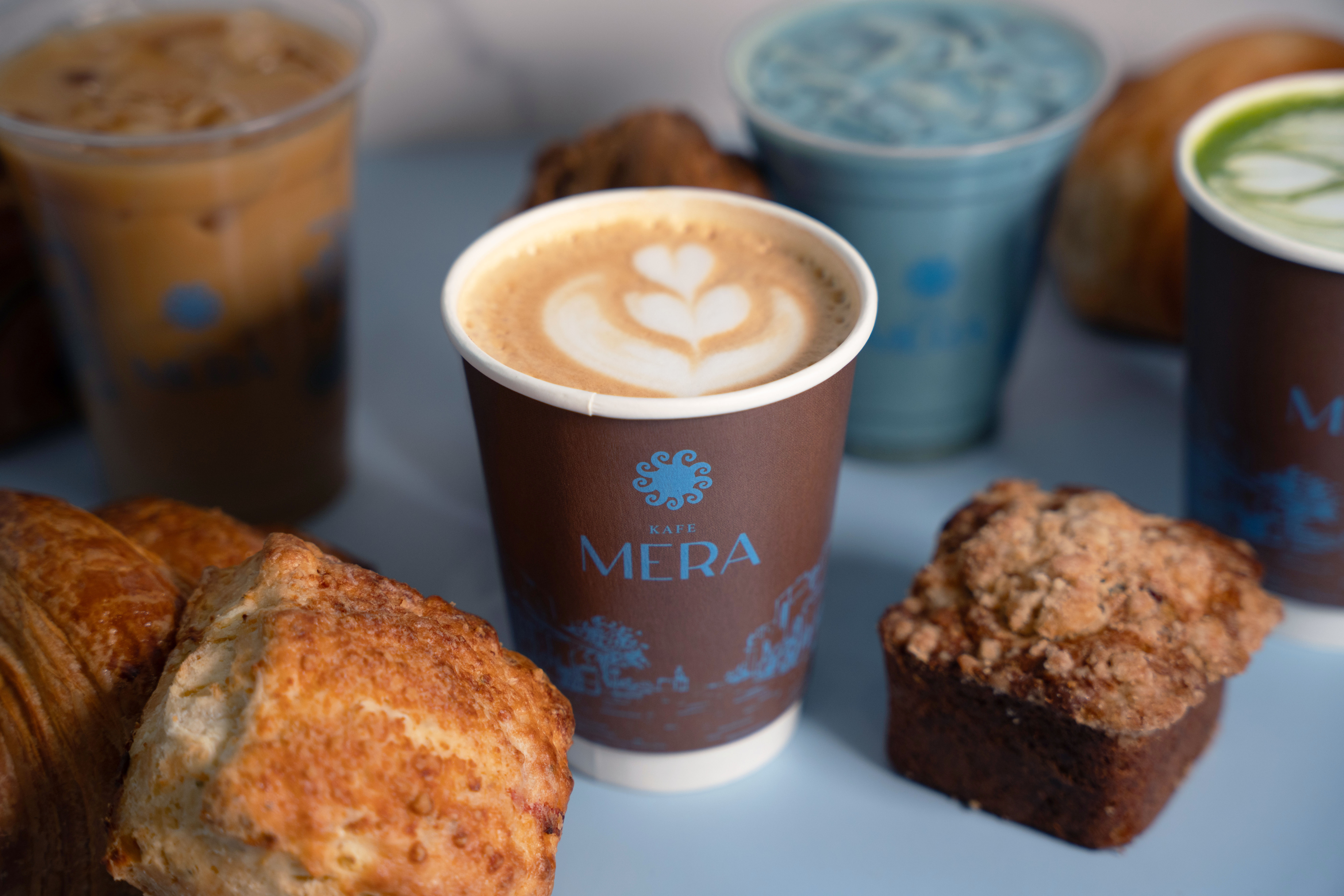 a close up of a plate of food and a cup of coffee