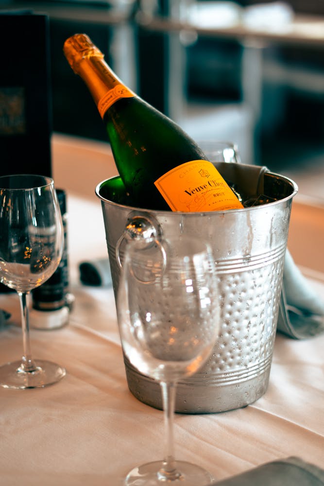 a close up of a wine glass sitting on a table