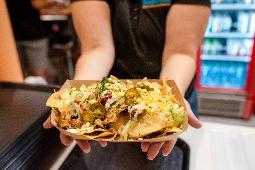 a close up of a person holding a sandwich