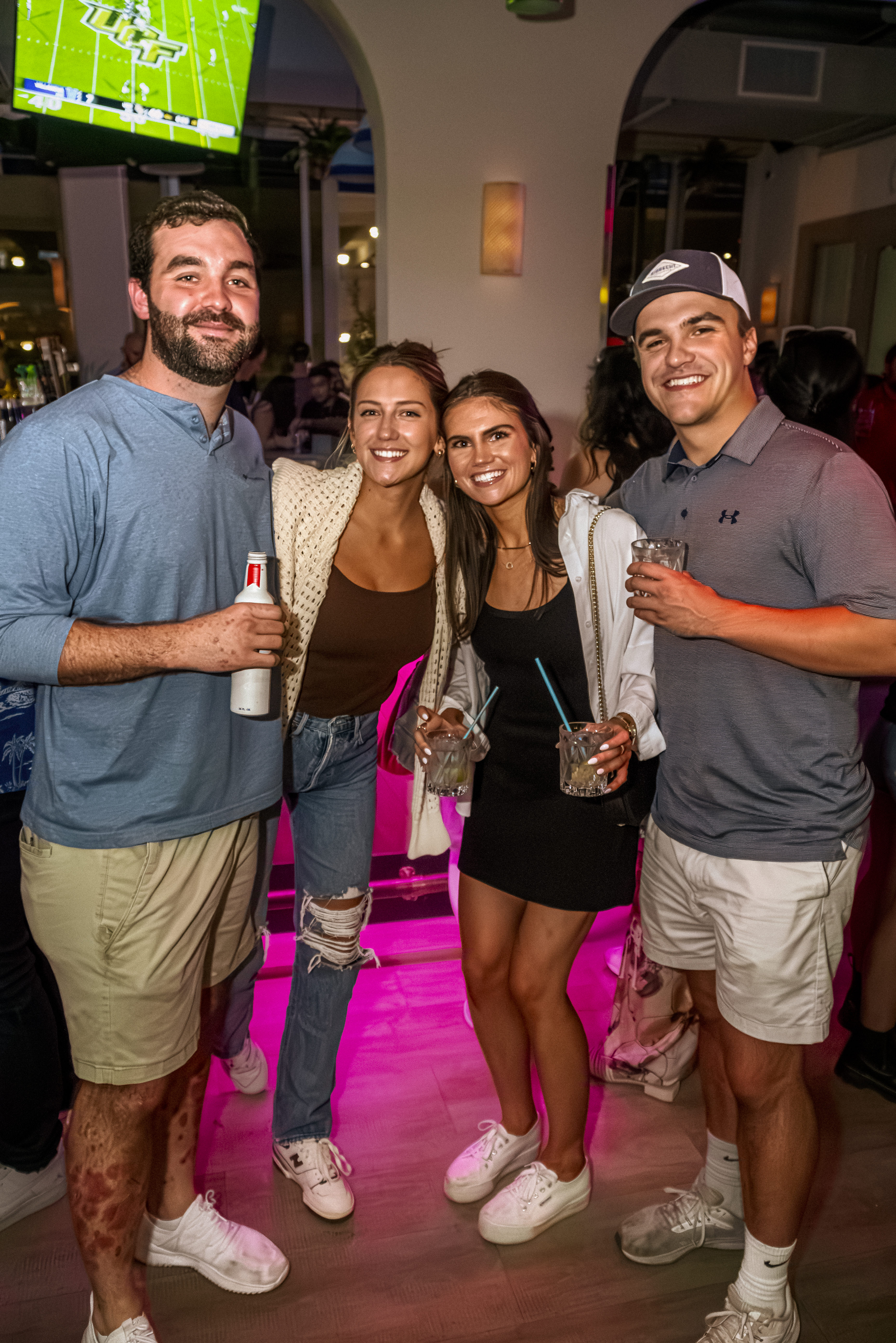 a group of people holding wine glasses