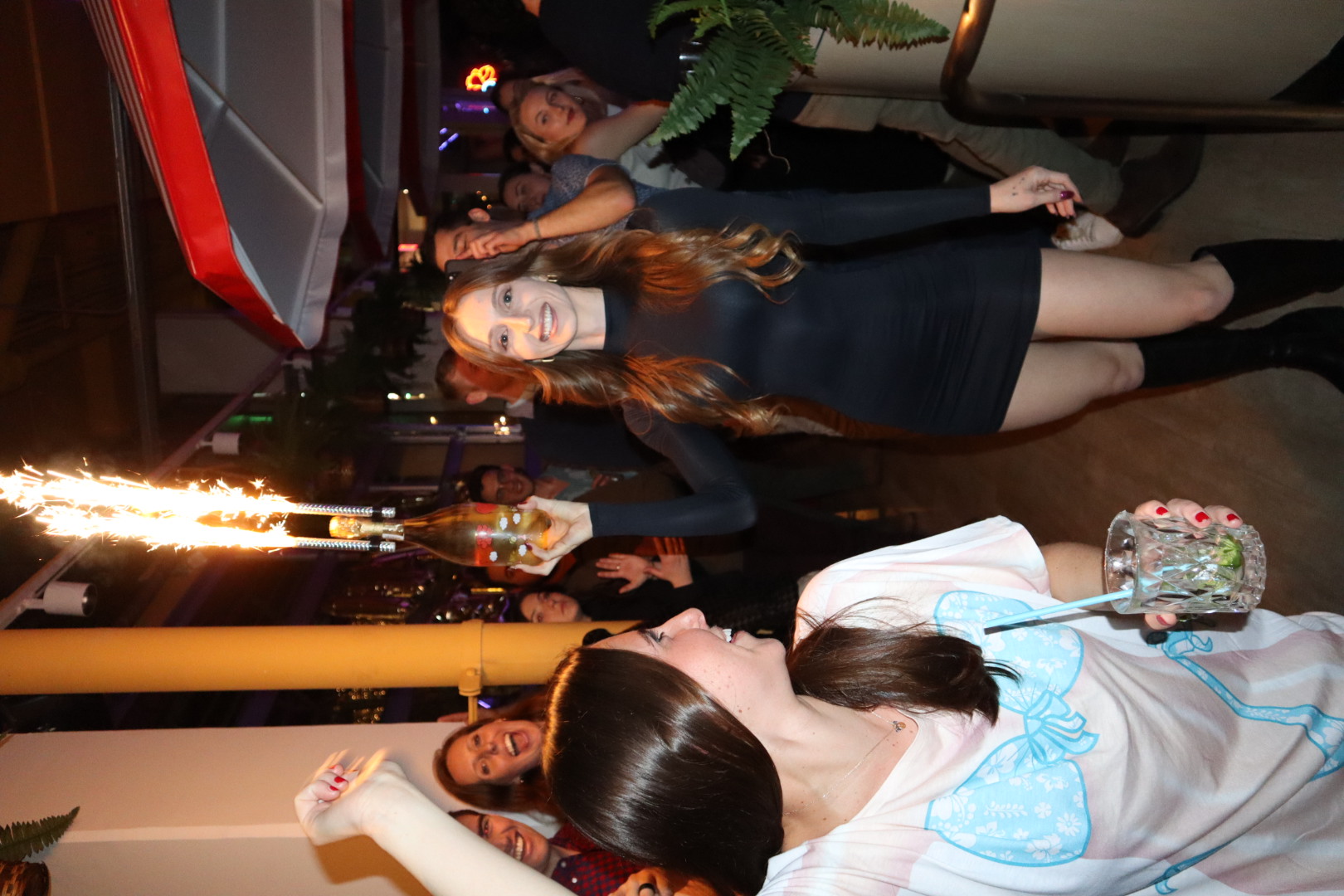 a group of people standing next to a woman