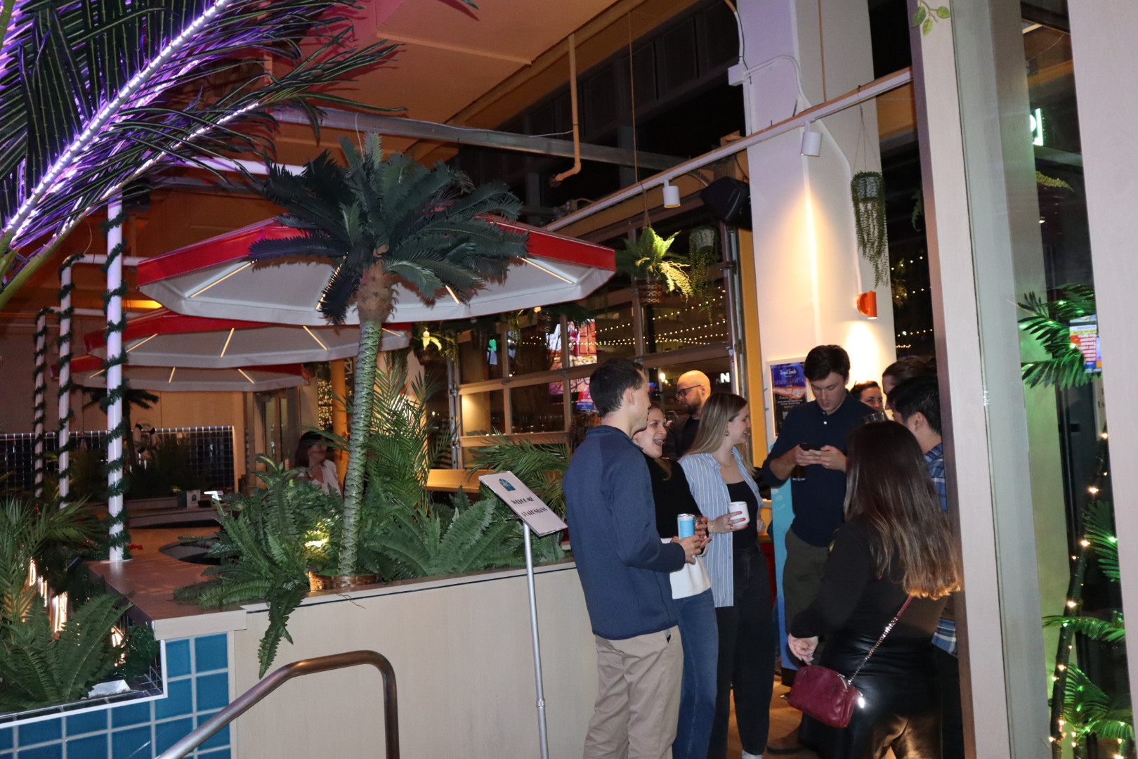 a man and a woman standing in front of a store